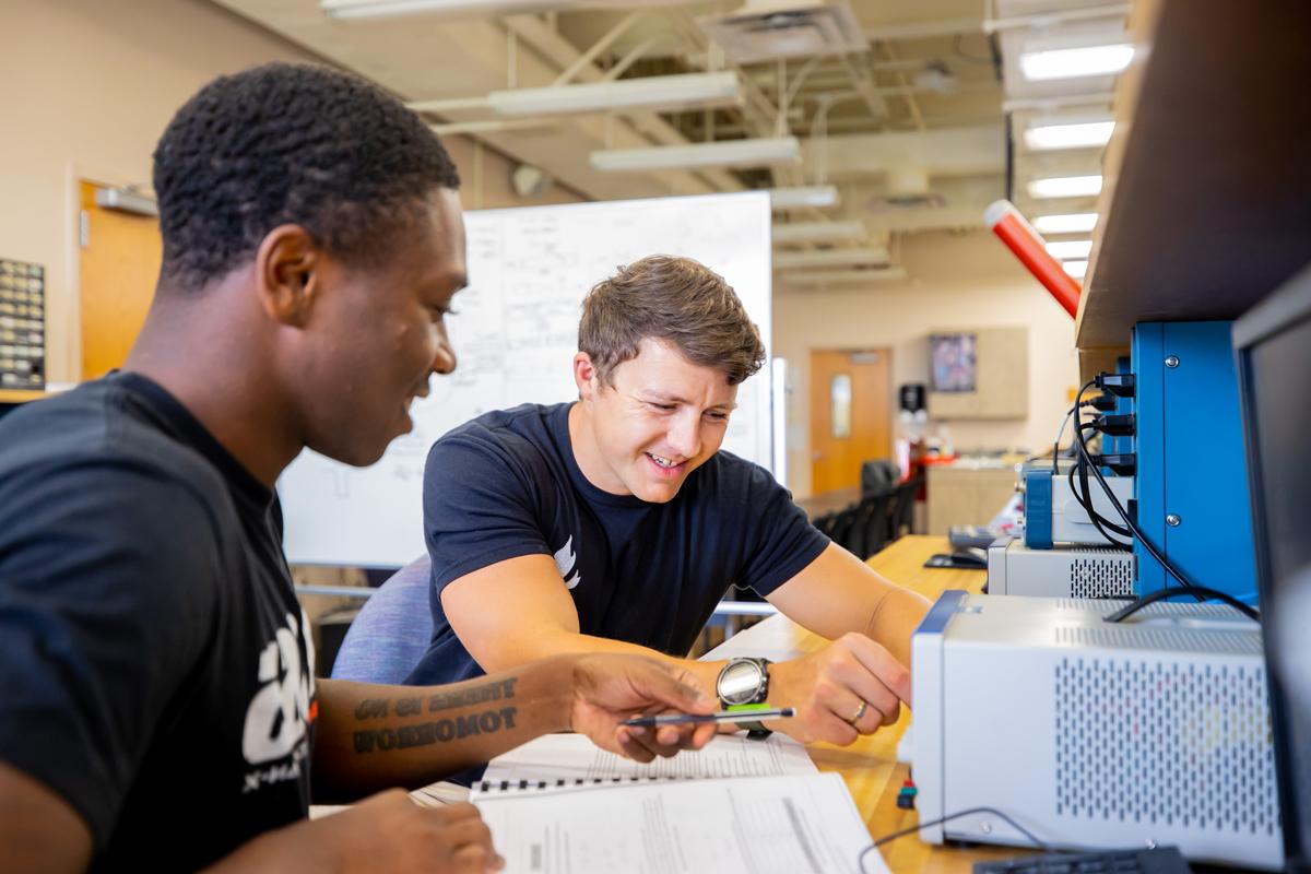 Students working together on equipment in the classroom